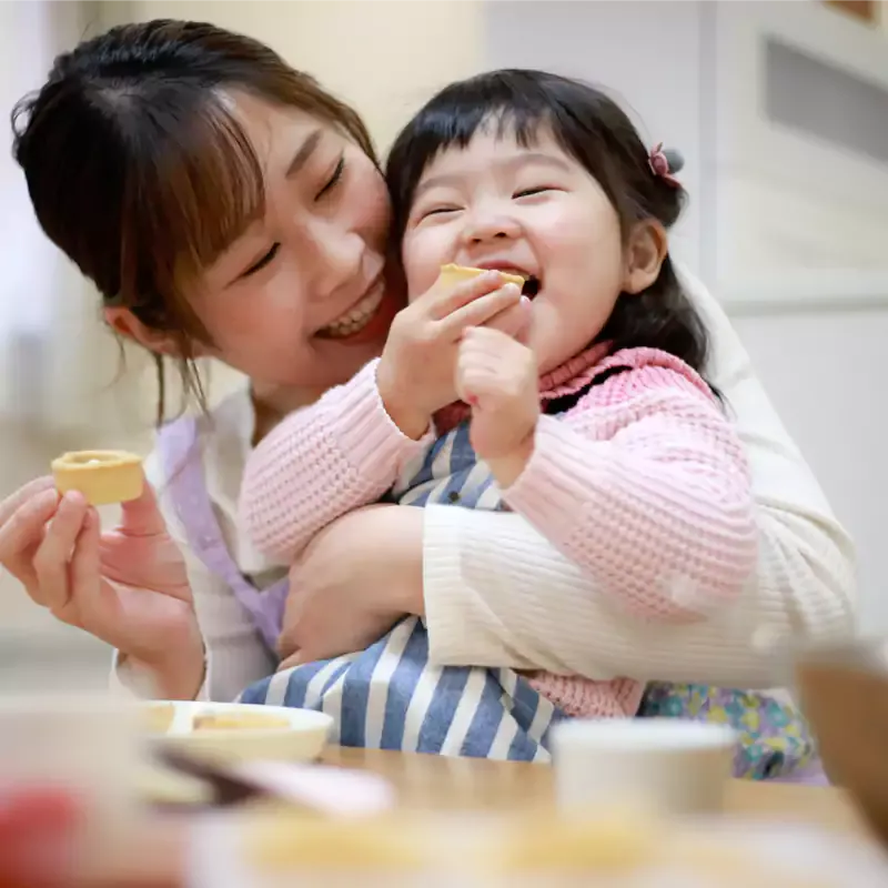 mom baking with daughter