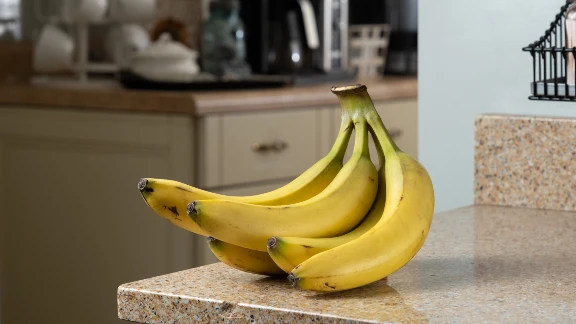 Ripe bananas on a kitchen counter