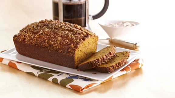 Homemade pumpkin bread with chopped nut topping