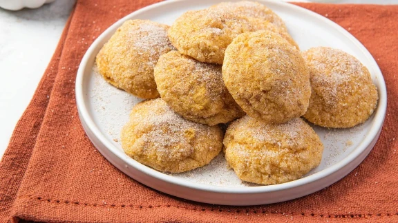 Pumpkin cookies coated in cinnamon sugar