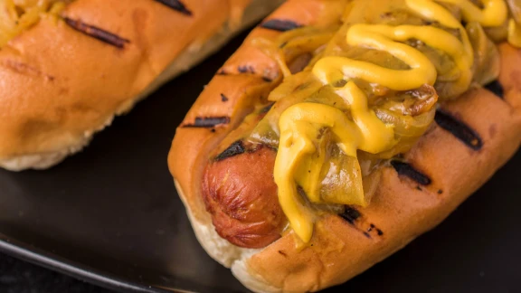 Grilled Hot Dogs with Beer-Mustard Onions