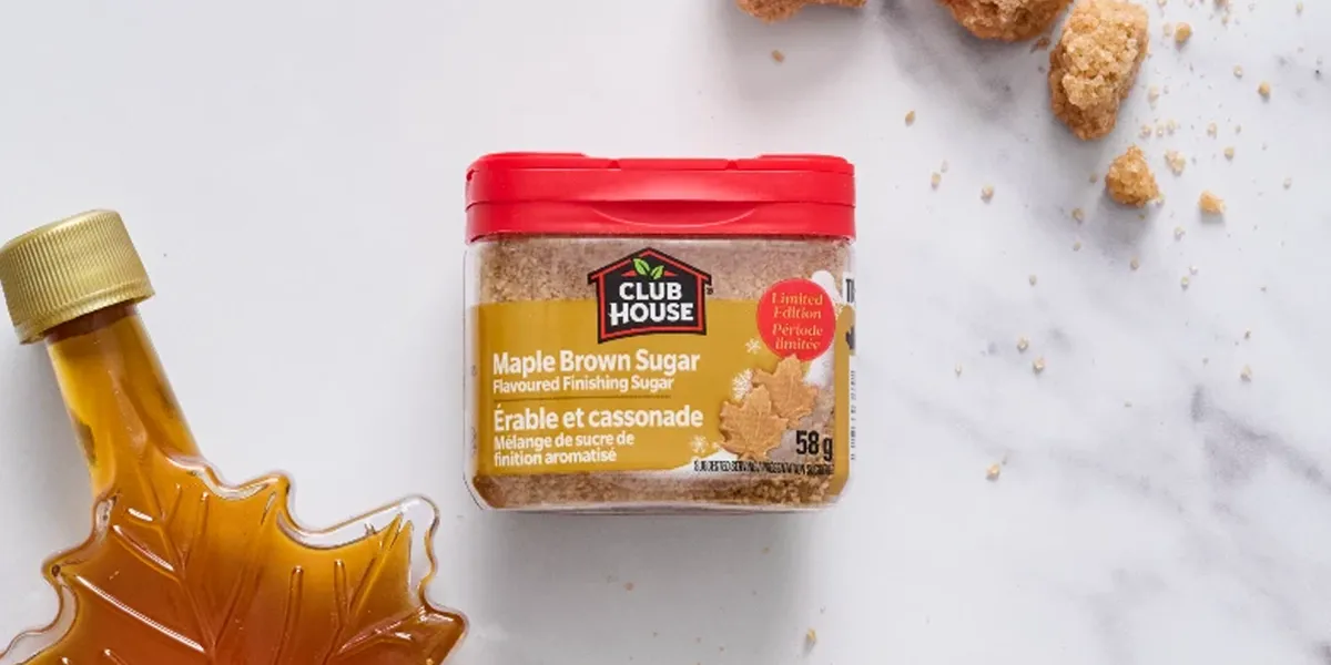 Club House Maple Brown Sugar Finishing Sugar 58g with maple syrup bottle and brown sugar on marble surface