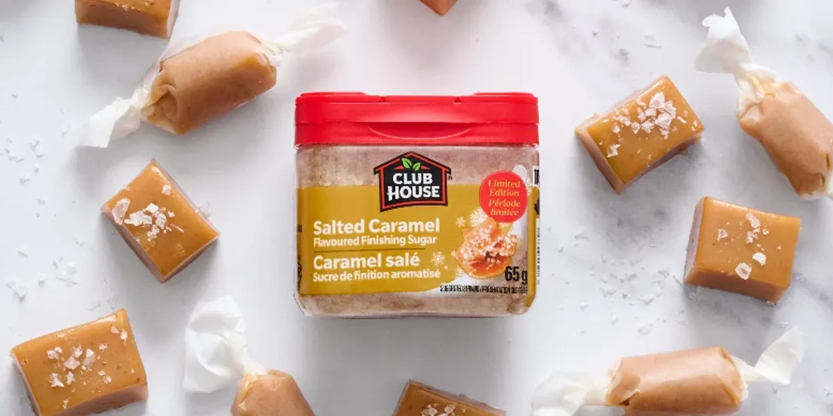 Club House Salted Caramel Finishing Sugar 65g with caramel candies on marble surface
