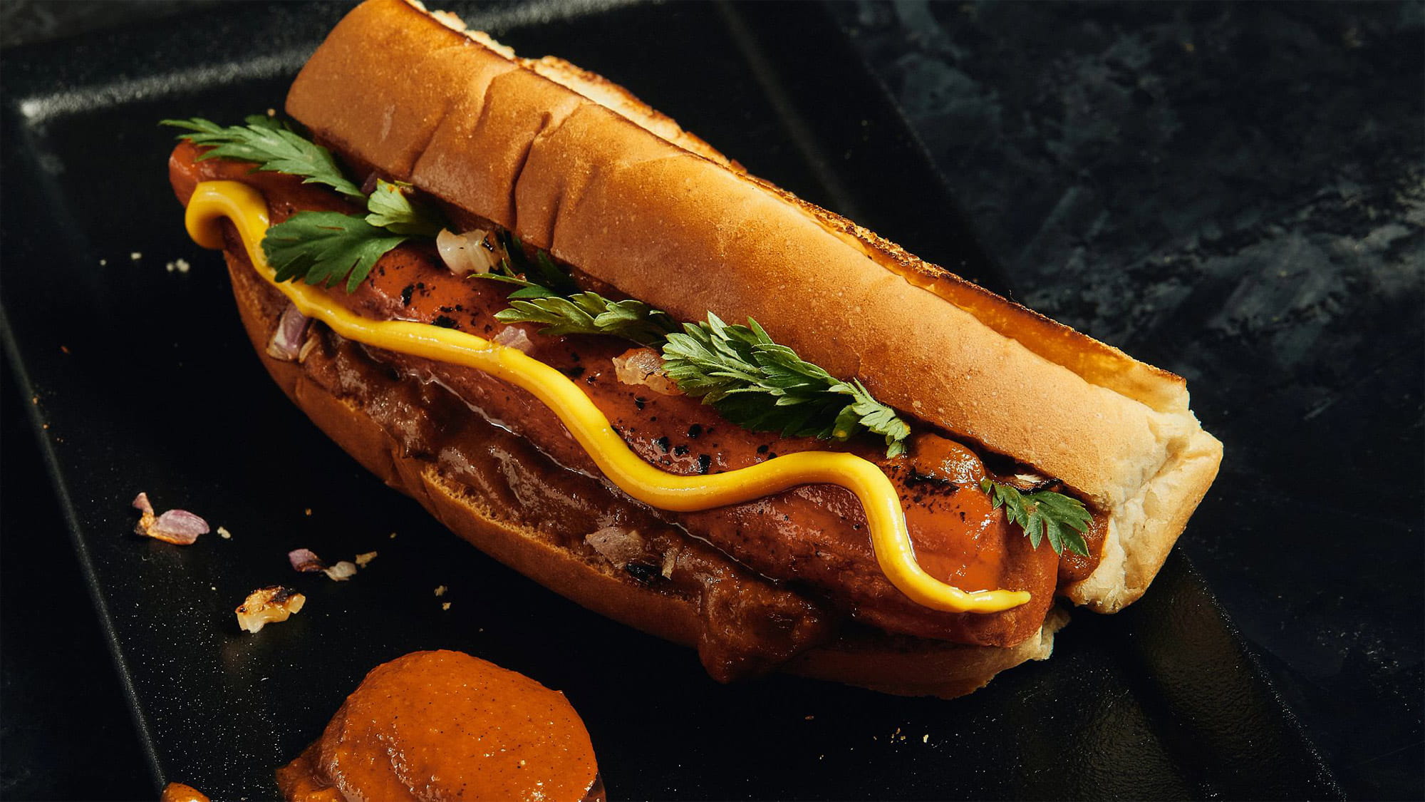 Brined Carrot Hot Dog with charred tomato ketchup