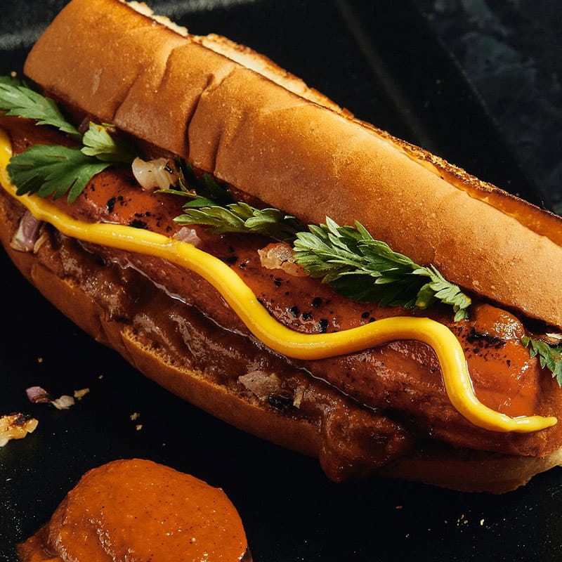 Brined Carrot Hot Dog with charred tomato ketchup