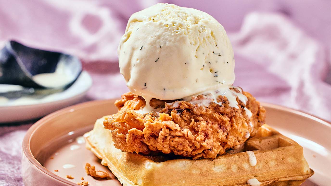 Scoop of buttermilk ranch ice cream on top of chicken and waffles
