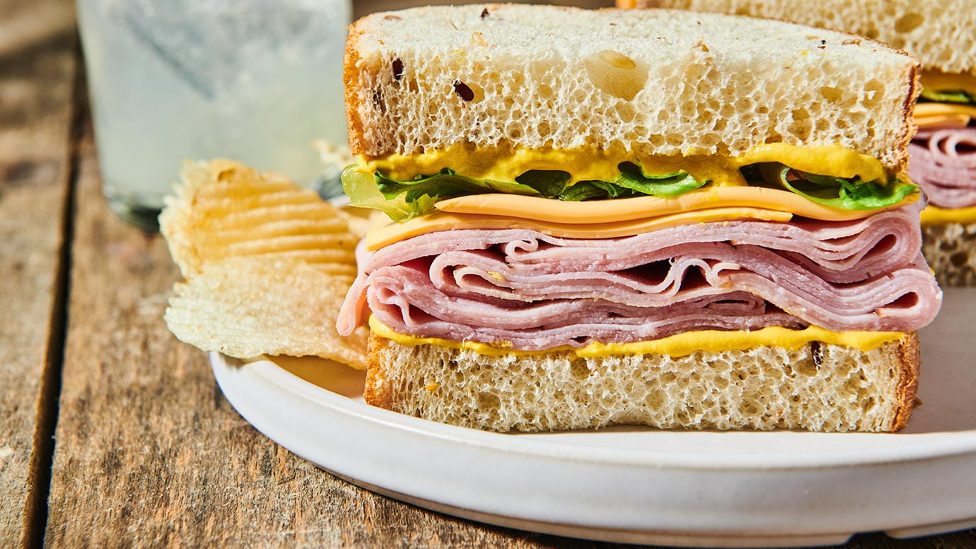 ham and cheese sandwich with creamy yellow mustard