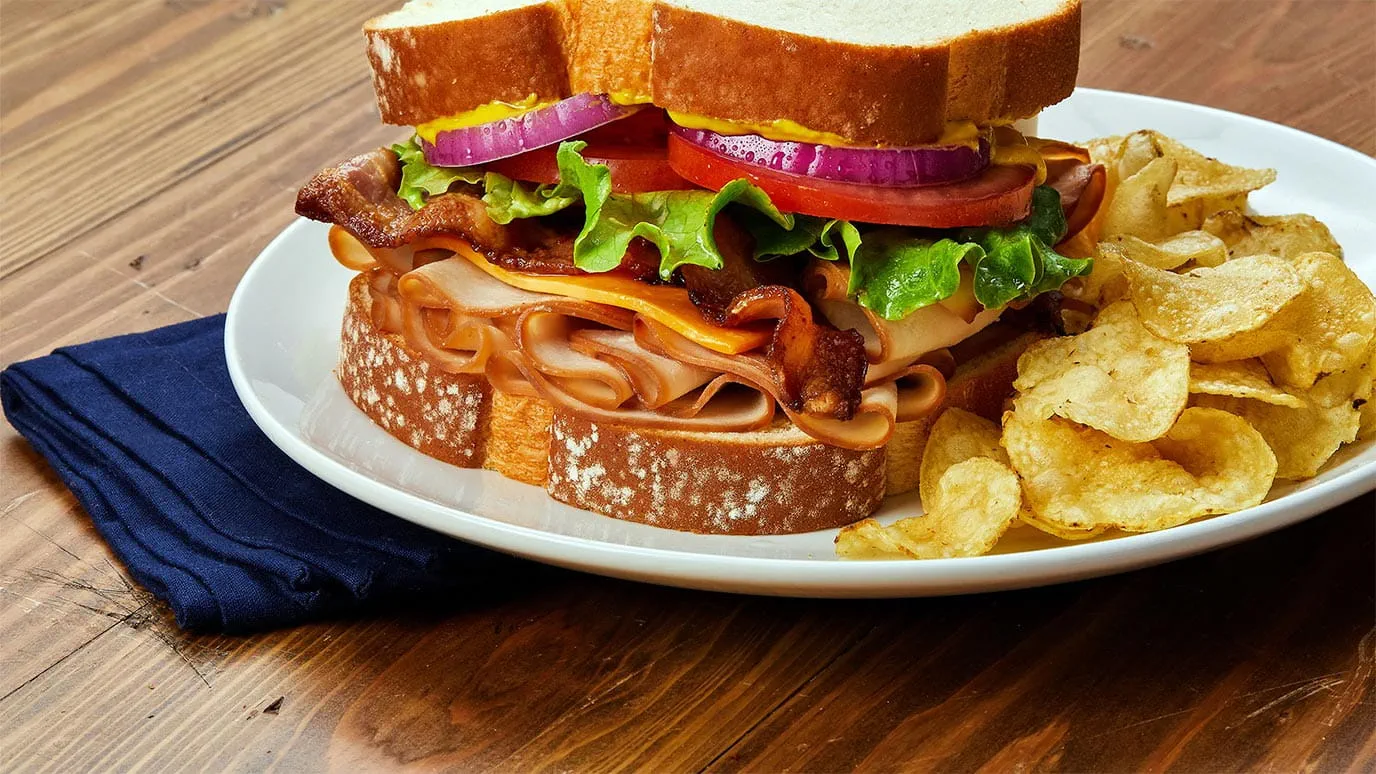 smoked turkey sandwich with cheddar and bacon