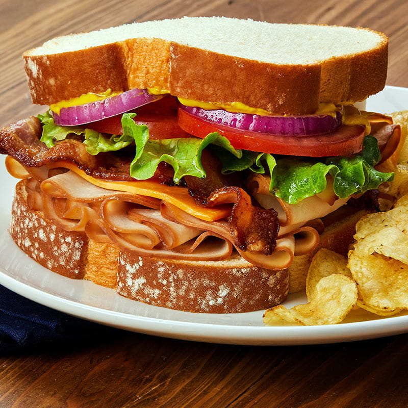 smoked turkey sandwich with cheddar and bacon